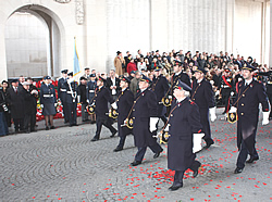 The Last Post Association buglers march past at the Menin Gate on 11 November.
