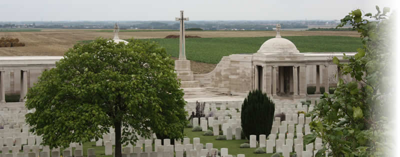 Dud Corner Cemetery and the Loos Memorial, with a view across the September 1915 battlefield of Loos, near Loos-en-Gohelle, France. Dud Corner Cemetery and the Loos Memorial, Loos-en-Gohelle, France.