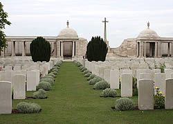Looking south-east towards the Cross of Sacrifice in Dud Corner Cemetery.