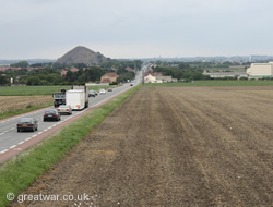 Looking north-west from the viewing platform towards the former 25 September 1915 British Front Line with the Mazingarbe slag heap in the distance.