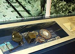 A display case containing items related to the fighting and the men of the Canadian Corps.