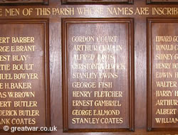 Names of men who fell in 1914-1918 commemorated on a wooden panel in the Holy Trinity Church, Bracknell, Berkshire.