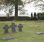 Basalt lava crosses and statue at Langemark German Military Cemetery, Langemark, Belgium.