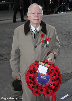Lieutenant-Colonel Graham Parker, OBE (Retired), a Vice-President of The Western Front Association with a poppy wreath.