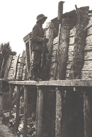 German soldier on sentry duty in a well-constructed trench on the Somme battlefield, 1916.