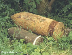 Artillery shells ploughed up and waiting for disposal.