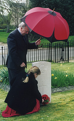 Lt Col Graham Parker and his daughter, Joanna, laying a poppy spray at the grave of an Australian soldier who died of wounds in England and was buried in a village on Salisbury Plain.