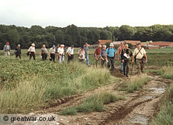 A group and their guide walking the battlefields in the Ypres Salient.