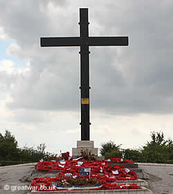 Poppy wreaths laid at the foot of the cross on 1st July.