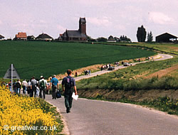 Tour group walking on the Somme battlefields at Thiepval, France