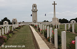 Villers-Bretonneux Memorial with graves in the Villers-Bretonneux Cemetery in the foreground.