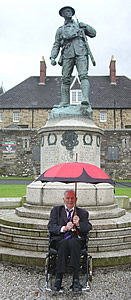 First World War Veteran Harry Patch shelters from the rain at the Duke of Cornwall's Light Infantry Regimental Day in Bodmin, June 2007 (photograph courtesy of Nick Fear)