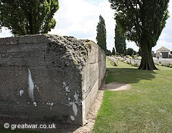 One of the numerous huge concrete German bunkers forming their strong line of defence on this ridge, left in the 
			  cemetery when it was enlarged after the war.