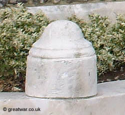 A sculpted British helmet on one of the entrance stones at Tyne Cot cemetery.