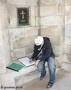 Signing the Visitors' Book at Tyne Cot Cemetery.
