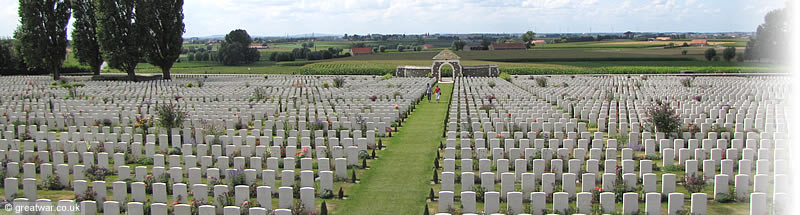 Tyne Cot Cemetery looking towards the spires of Ypres and the hill of the Kemmelberg on the horizon.